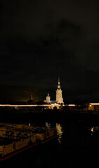 Fototapeta premium Gothic glow casts over city's historic fortress, Slavic lore whispers, illuminating Nights of Museums, maritime shadows dance