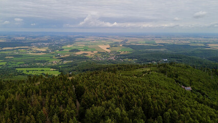 Fototapeta premium Opawskie Mountains, Poland. View from the summit to the mountain valley of the Czech Republic and Poland.