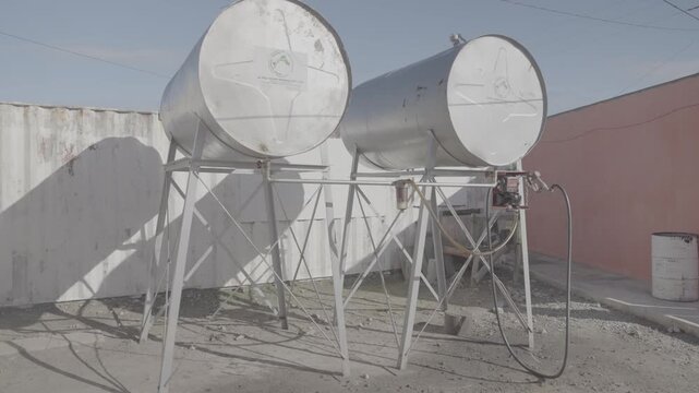 Metal cylinders to store water or fuel in , on the roads of the Karoo in Western Cape Province, South Africa.