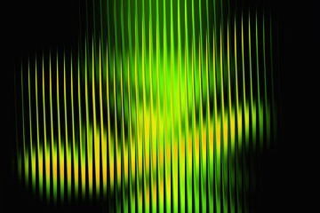 Abstract vertical green and yellow light streaks on a dark background