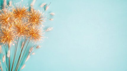 Obraz premium Golden sparkler fireworks on blue background with festive celebratory atmosphere
