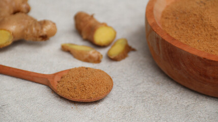 Ginger powder on wooden spoon