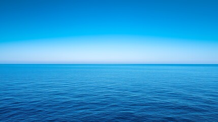 Obraz premium Minimalist Serene Seascapes: Clear Horizon Separates Sky (Light to Dark Blue) & Ocean (Multi-Shade Blue + Ripples)