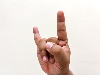 Rock on gesture expressing enthusiasm and joy through a hand gesture offering a cultural symbol of...