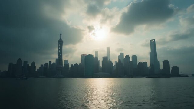 Moody city skyline reflecting sunlight over water during cloudy afternoon