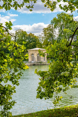 Obraz premium Carp Pond with the octagonal Pavillon de l Etang built in the 17th century at the Chateau de Fontainebleau, historic royal residence in France.