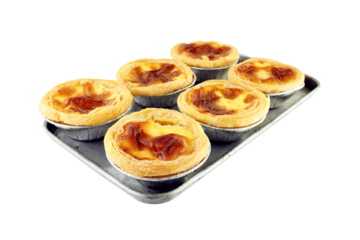 freshly baked Portuguese egg tart on aluminium tray isolated on transparent