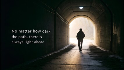 Lone figure walking through a dark tunnel towards the light of hope.