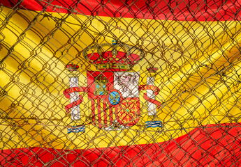 Barbed wire on Flag of Spain background. Spain flag with Barbed wire, close-up, background. Barbed...