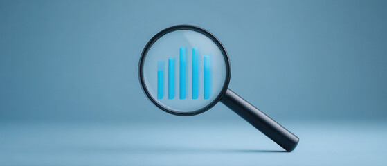 Magnifying glass chart analysis with blue bar graph insight and focus