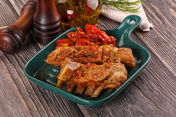Baked lamb ribs with vegetables