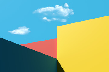 Colorful geometric shapes creating abstract background under blue sky with clouds