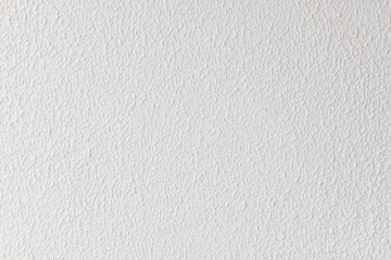 White texture background with coarse surface material of plaster wall inside modern house. simple uneven pattern creates calm and minimalist backdrop for design