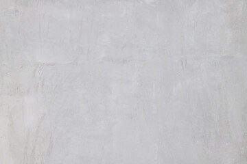 Grey concrete texture provides minimalist background material for modern house wall. smooth polished surface has subtle pattern for construction and architectural design