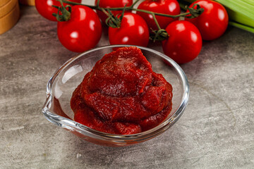 Red tomato paste in the bowl