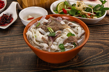 Vietnamese Pho Bo soup with beef and noodles
