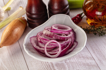 Sliced red onion rings heap