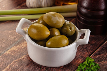 Greek green olives marinated in the bowl
