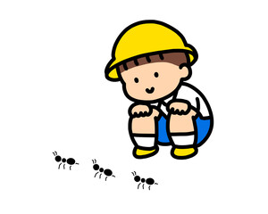 アリを観察する男の子