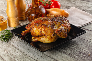 Baked in oven whole chicken with spices