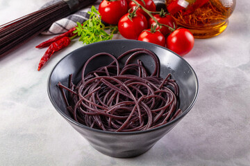 Boiled black rice noodles spaghetti