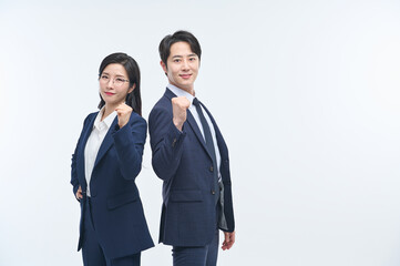 Cheerful Asian Male and Female Business Professionals Making Fist Gesture for Success