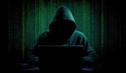 Mysterious Hacker Working on Laptop in Dark Room.
