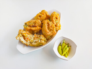 Deep fried stuffed tofu white chopped mix vegetables or called Tahu Isi traditional popular snack food isolated on white background