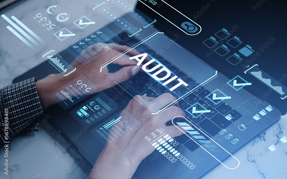 Aufkleber digital audit interface over hands typing on laptop keyboard in office workspace.