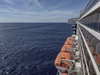 Outdoor sun pool promenade deck with chairs or sun loungers with table on balcony or terrace or...