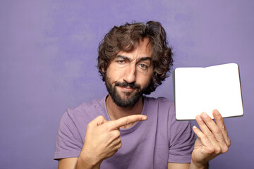 young adult bearded man with a poket notebook