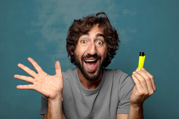 young adult bearded man with a lighter