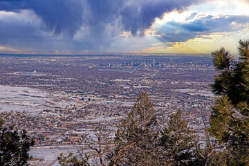 Obraz premium Panorama view over Denver Colorado city with snow and storm clouds