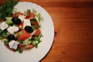 Freshly Made Mediterranean Salad on White Plate.