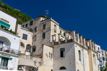 Fototapeta premium Amalfi, Italy - August 19, 2019: View of the residential buildings of the city of Amalfi on one of the central streets