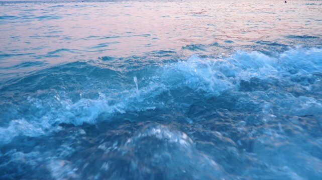 Soft morning light dances on the water, creating a serene atmosphere at Canj beach in Montenegro. Waves soothe the shore as the day begins in this coastal paradise
