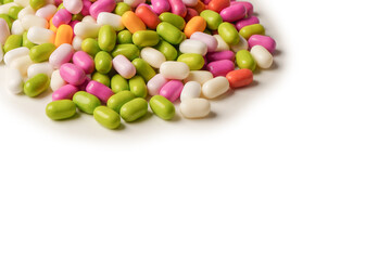 Sweet multicolored candies isolated on white background.
