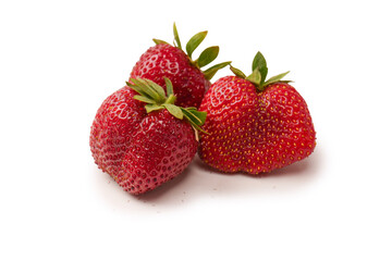 Fresh group of berries isolated on a white background.