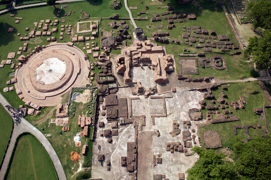 Aerial view of Dhamek Stupa's ancient brickwork standing proudly amidst the lush greenery, showcasing the rich heritage, Varanasi, Uttar Pradesh, India.