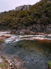 A Small River with Rapids in a Rocky Valley