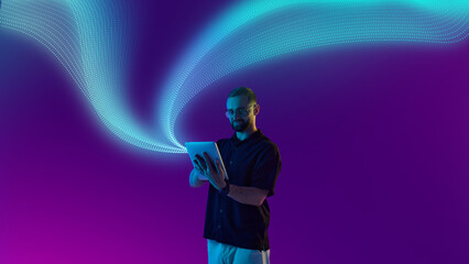 Bold colorful poster. Casual man using tablet under digital wave with bright futuristic expression. Concept of mobile apps, e-commerce lifestyle, social media, and creative editorial design.