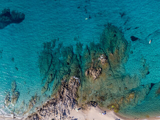 Aerial view of the beautiful beach of Vignola Mare with its tower