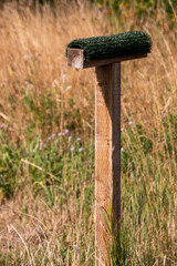 A view of a perching post of birds