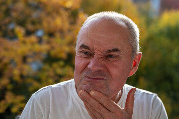 senior man skeptical face reveals suspicion, with expression, Emotional portrait doubtful look...