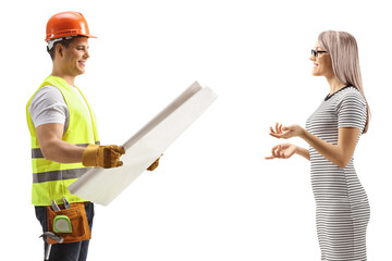 Contractor with a blueprint having a conversation with a woman