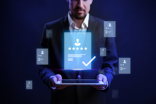 Professional evaluating online reviews using digital tablet with glowing display - Powered by Adobe