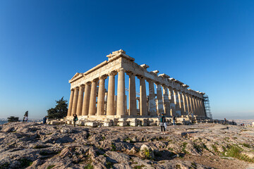 Athens, Greece. The Parthenon on the Acropolis, built between 447 and 432 BC under Pericles, dedicated to Athena Parthenos, shining under a warm blue sky