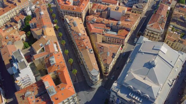 This drone shot shows the vibrant urban fabric of Montpellier, France, revealing a blend of historic architecture and modern developments under clear skies.