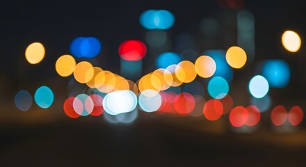 Vibrant streams of colorful bokeh lights blur across a dark urban street, creating a dynamic and abstract city nightscape background