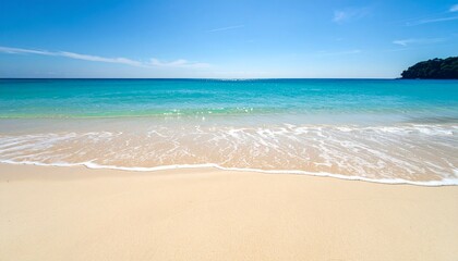 Fototapeta premium Turquoise ocean waves gently wash onto the pristine white sand beach under a clear blue sky, creating a tranquil and idyllic coastal scene.